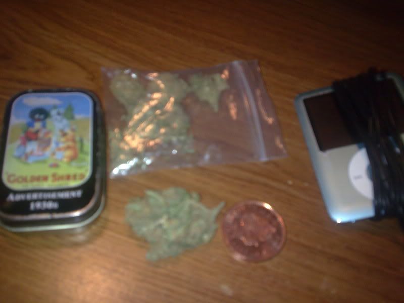 the bag of weed with my stash tin ipod and 2p coin!