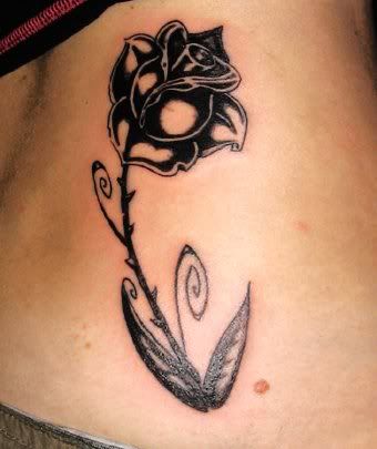 Tattoo Designs Roses Black tribal dragon and red rose tattoo on the body.